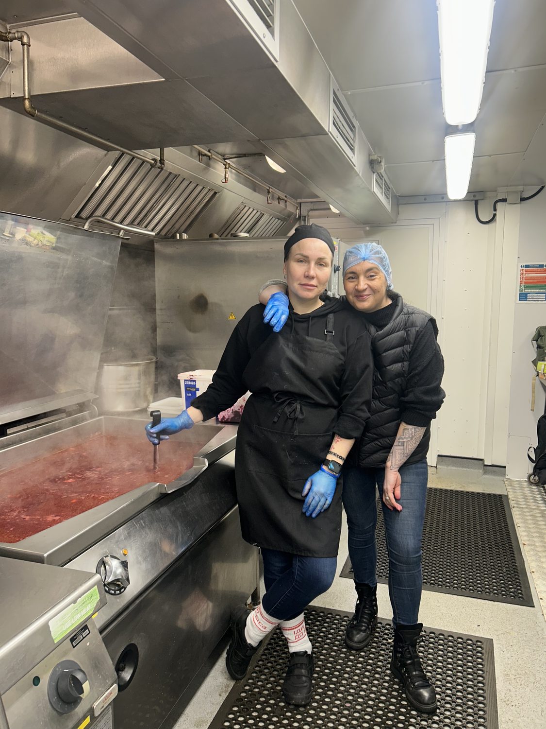Volunteers preparing borshch for Ukrainian defenders